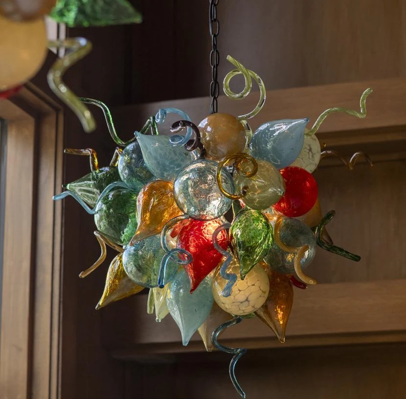 Hand-blown glass lighting by James Hayes adds color and individuality.